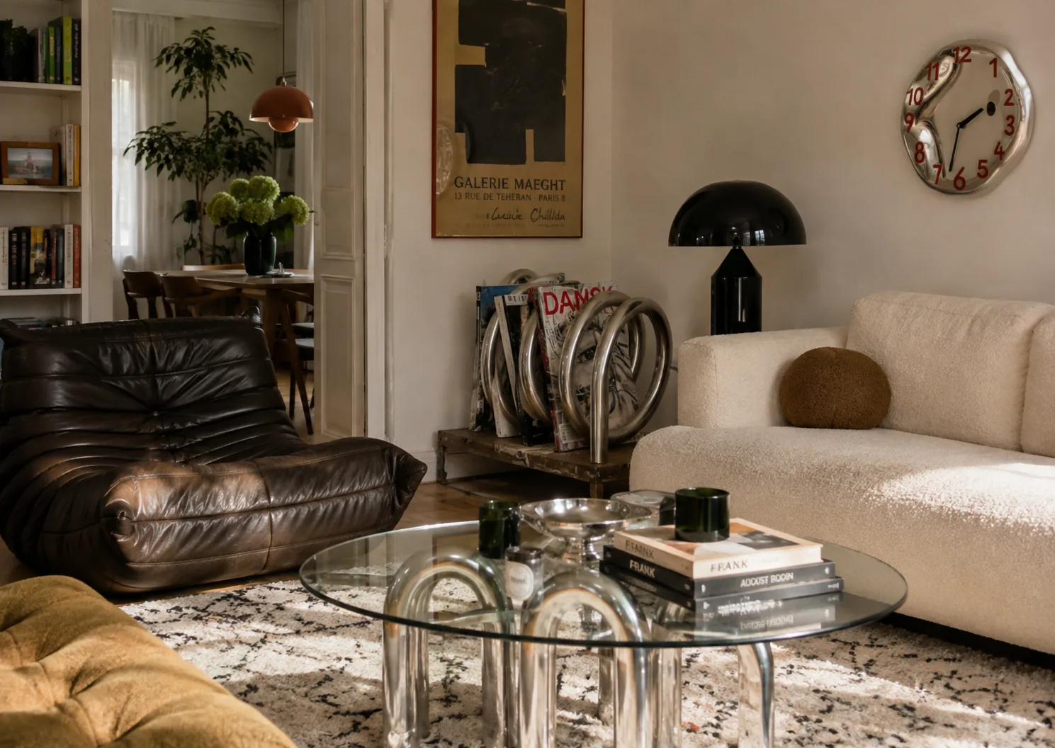Lived-in living room mixing chrome with leather and soft upholstery