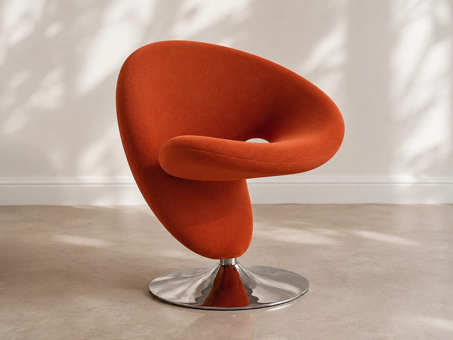 Orange sculptural swivel chair with polished chrome base