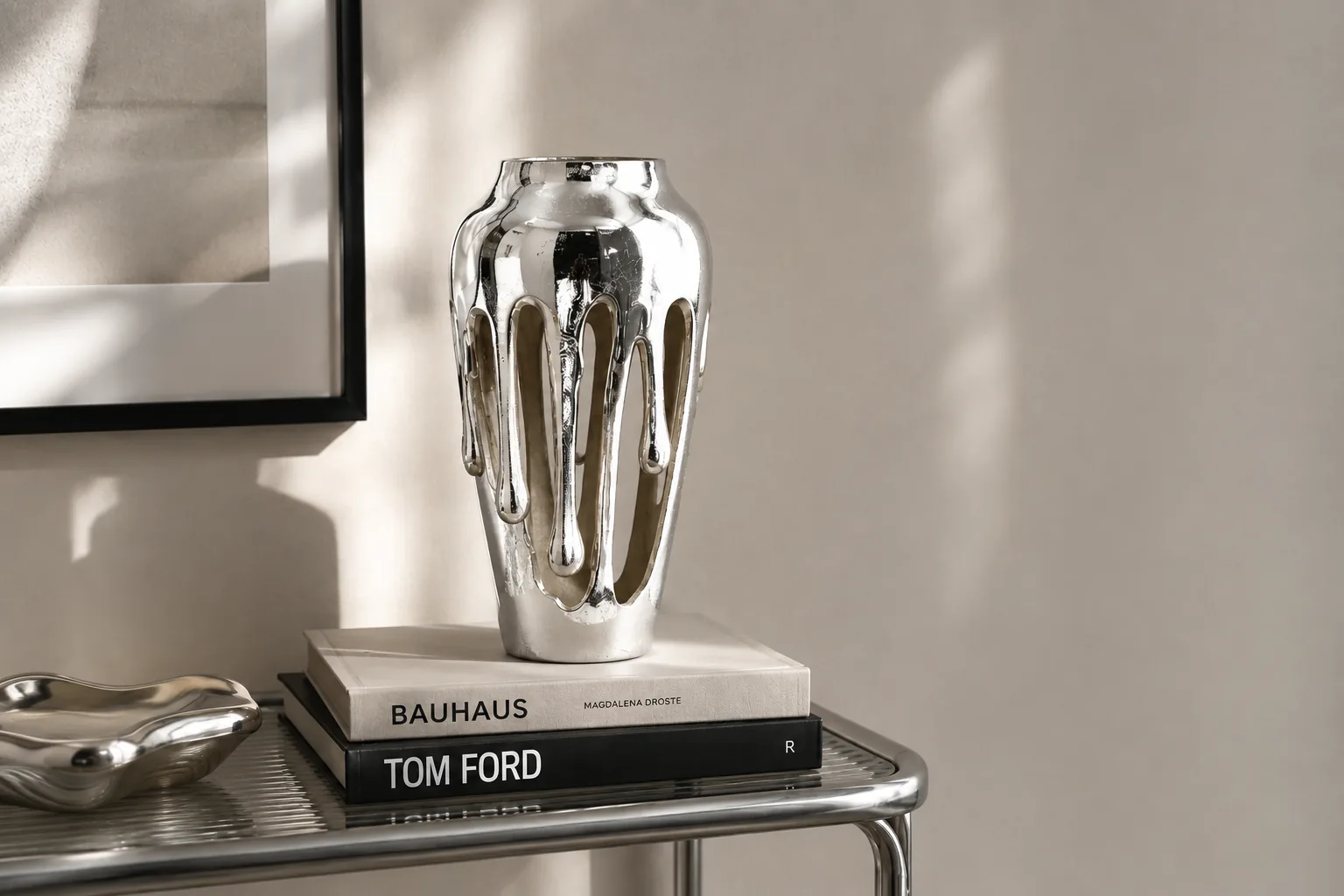 Melting silver chrome vase styled on a console